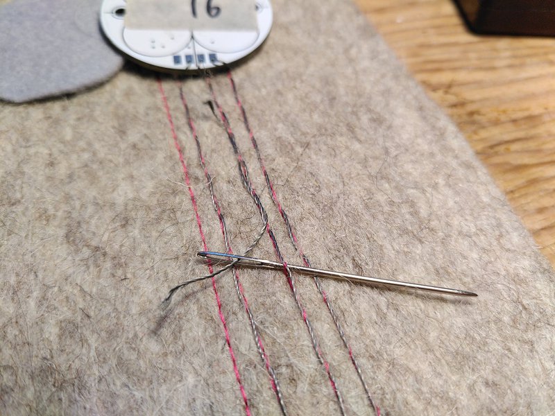 Adding more conductive thread to extend a connection
